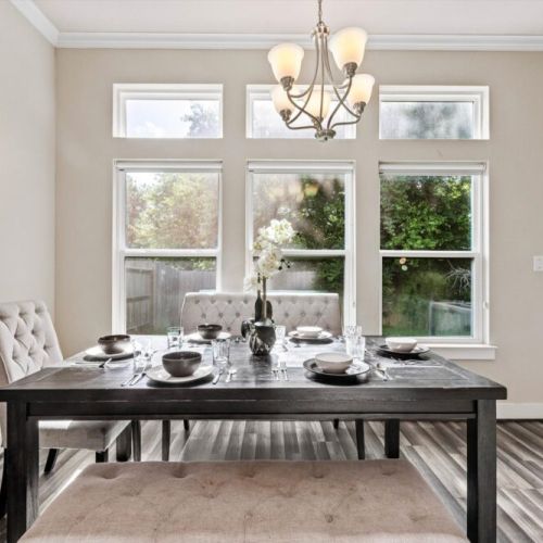 Spacious dining table that sits 6 with full tableware and silverware included.