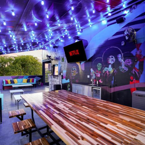 Prepare snacks, pour drinks, and let the karaoke fun begin under the glow of rooftop lights