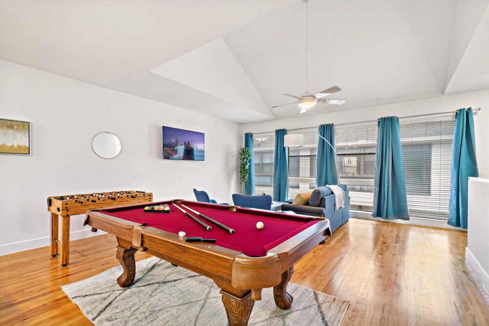 Full-size pool table and foosball table included.