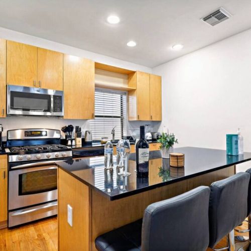 Fully equipped kitchen with high quality granite countertops.