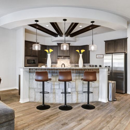 Kitchen island with 3 bar stools for your convenience.