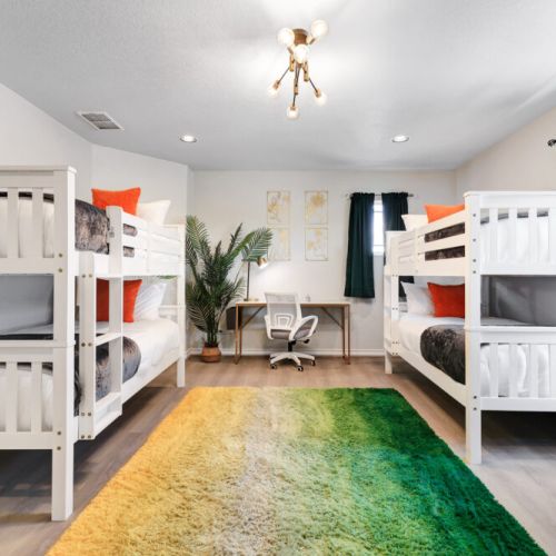 5th bedroom with 4 twin size beds (2 bunk beds). Dedicated workspace included.