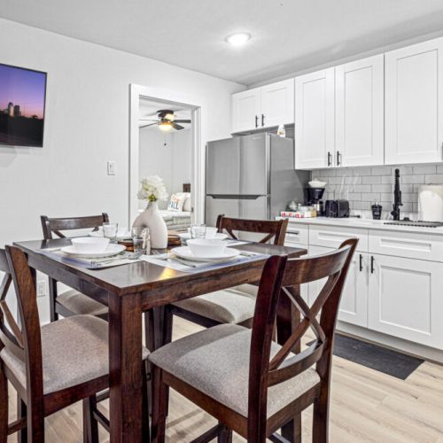 Charming dining table that sits 4 with full tableware and silverware included.