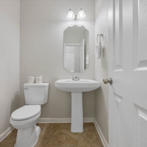 Half bath adjacent to main dining room for maximum convenience.