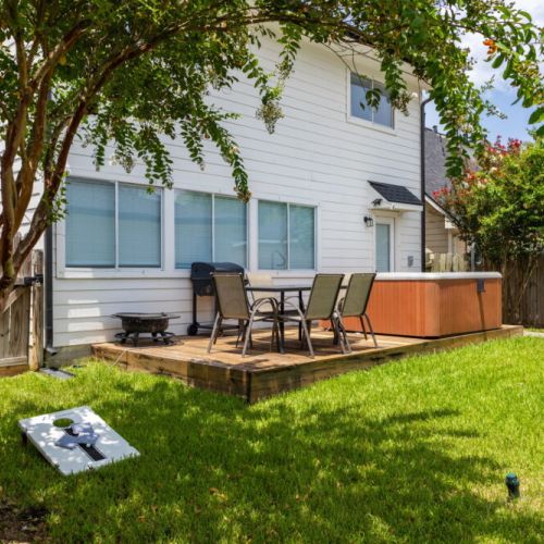 Your perfect backyard retreat — hot tub, BBQ cookouts, fire pit evenings & friendly cornhole battles.