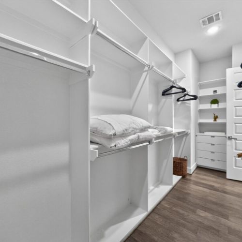 Fully-equipped primary bedroom closet.