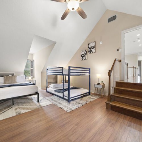 4th bedroom with 2 full size bunk beds, 1 queen size bed, and 1 twin size futon.
