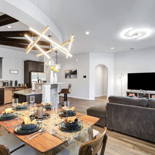 Spacious dining table that sits 6 with full tableware and silverware included.