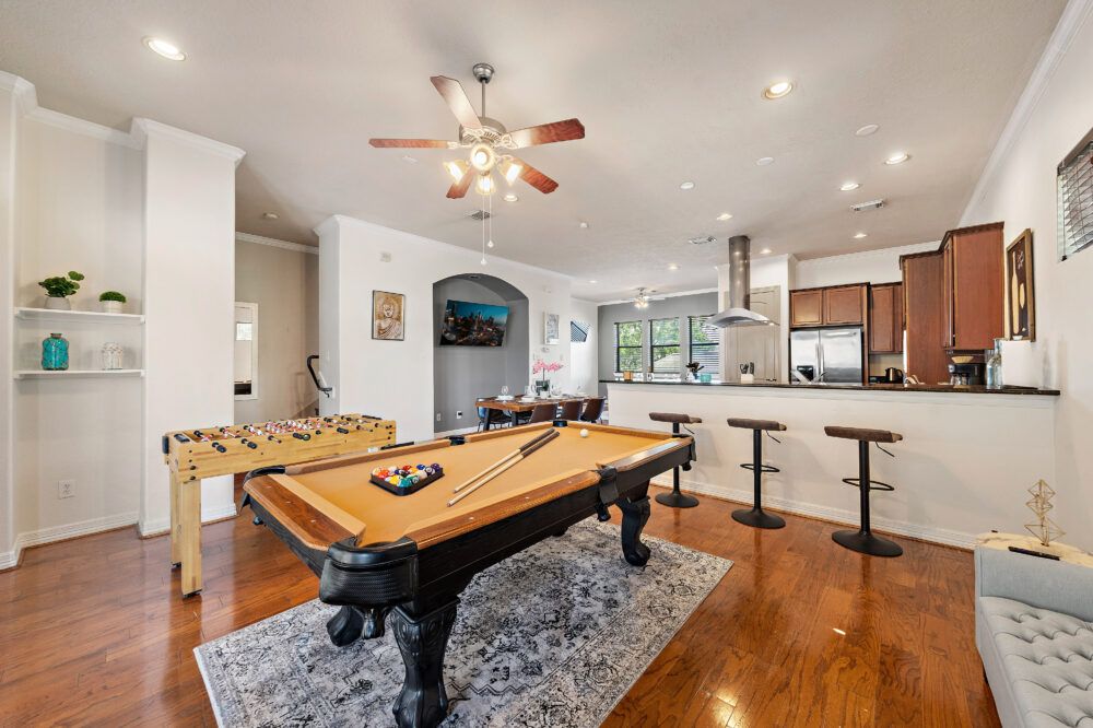 Full-size pool table and foosball table included.