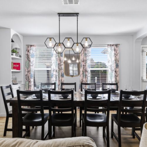Spacious dining table that sits 10 with full tableware and silverware included.