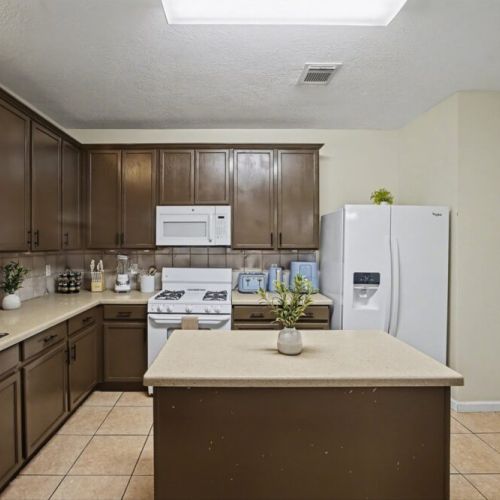 Fully equipped kitchen with high quality granite countertops.