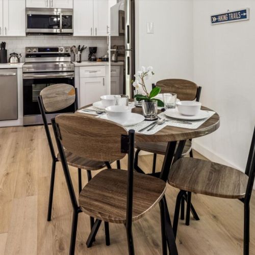 Charming dining table that sits 4 with full tableware and silverware included.
