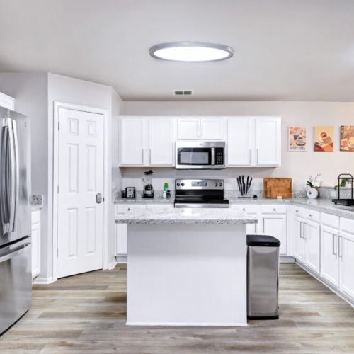 Fully equipped kitchen with high quality granite countertops.