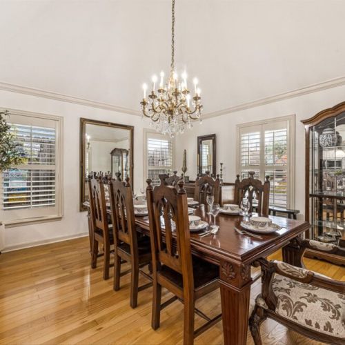 Spacious dining table that sits 8 with full tableware and silverware included.