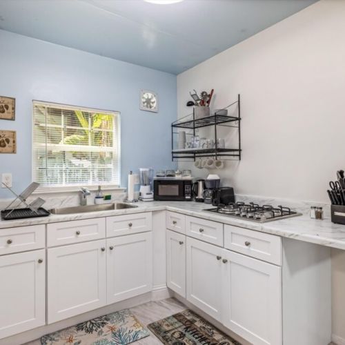 Fully equipped kitchen with stainless steel appliances and high quality granite countertops. Coffee bar included!