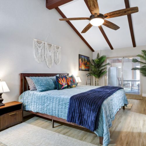 Primary bedroom with a king size bed with 65" Roku TV!