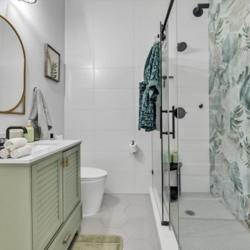 Bathroom with shared access from bedrooms 1 and 2 is fully stocked with all you need. Makeup pads and q-tips included.