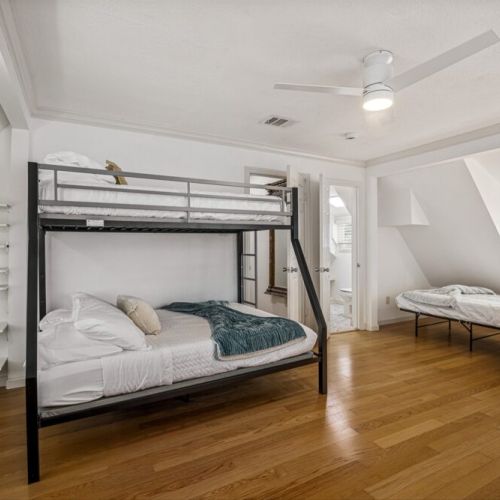 3rd bedroom with 1 twin size bed and 1 full size bed (bunk bed), and 1 separate twin size bed.