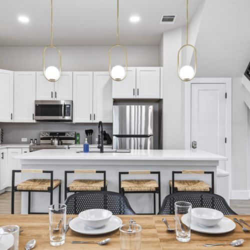 We have 4 barstools for your convenience! Fridge does NOT dispense water or ice.