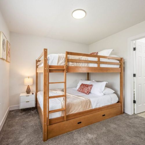 5th bedroom with  2 queen size beds and 1 twin size bed (triple bunk bed).