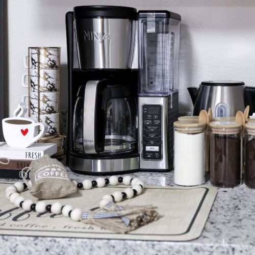 Ninja coffee maker with ground coffee capabilities with complimentary coffee, decaf, tea, sugar, cream, and sweetener