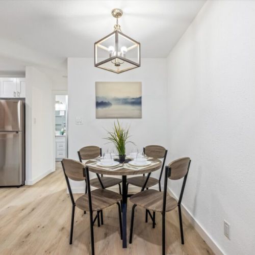 Charming dining table that sits 4 with full tableware and silverware included.