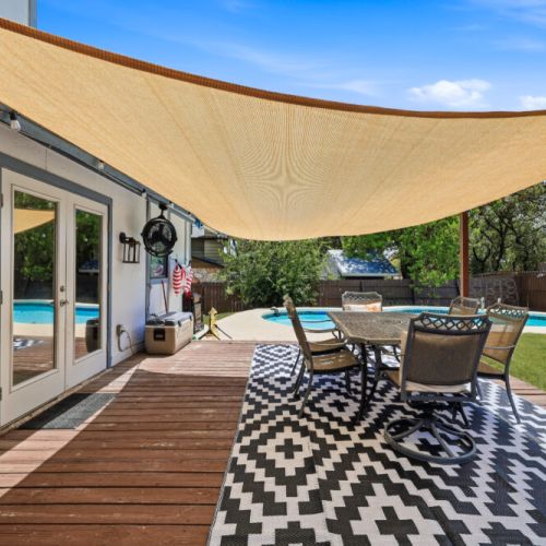 Deck with outdoor dining table included for maximum comfort.