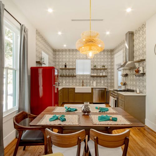 Spacious main dining table that sits 5 with full tableware and silverware included.