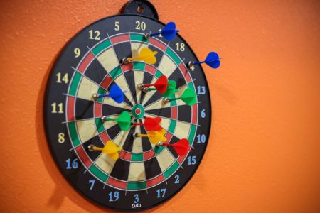 Test your aim with a fun game of darts in the game room.