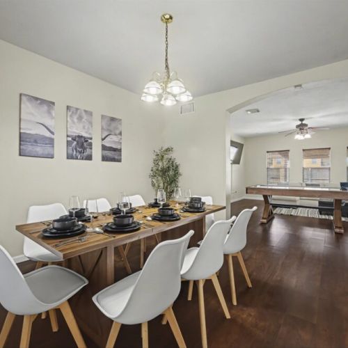 Spacious dining table that sits 8 with full tableware and silverware included.
