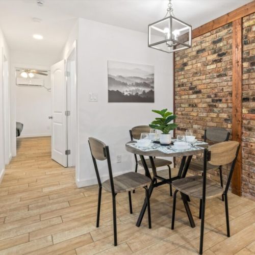 Charming dining table that sits 4 with full tableware and silverware included.