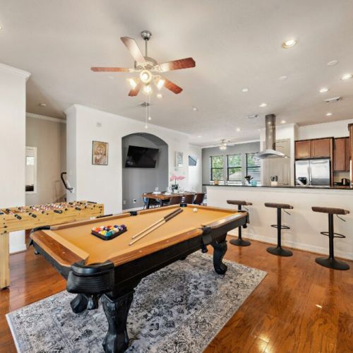 Full-size pool table and foosball table included.