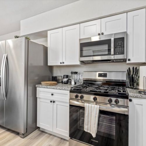 Stainless steel appliances Fridge dispenses water and ice.