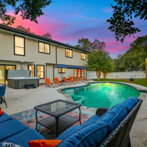Whether you're cooling off in the pool or relaxing in the hot tub, this backyard is made for unwinding.