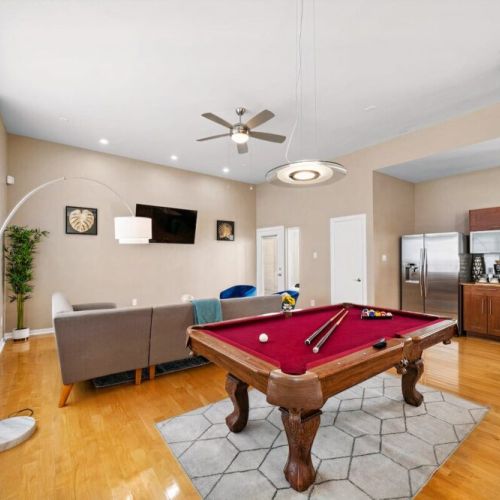 Full-size pool table included.