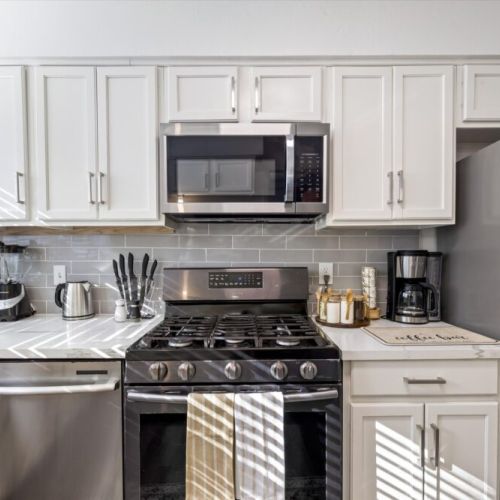 Ninja coffee machine with complimentary coffee,  decaf, tea, sugar, cream, and sweetener.