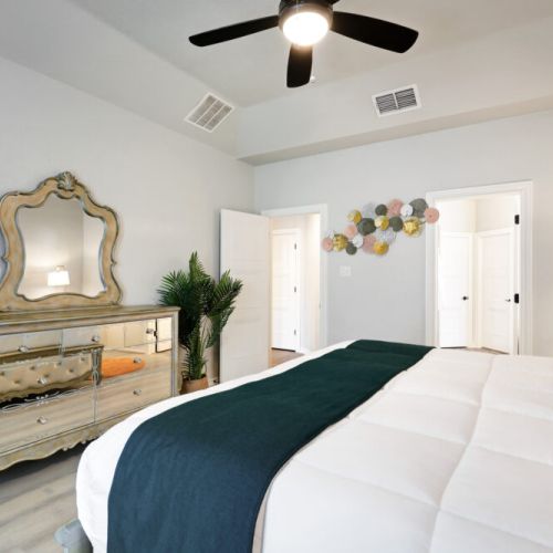 Decorated with high-quality linens. Dresser included.