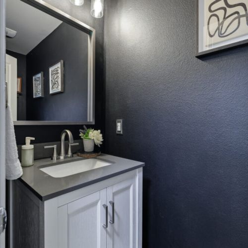 Half bath in next to th kitchen for maximum convenience.