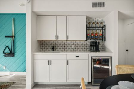 Coffee bar and wine fridge included.