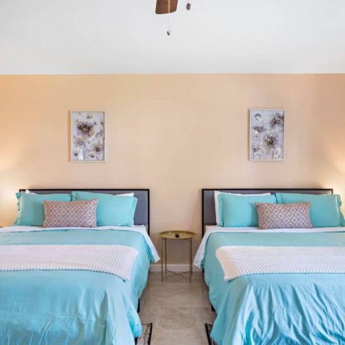 Primary bedroom with two queen size beds! Super comfortable memory foam mattresses.