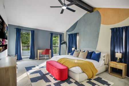 Stylish primary bedroom with a king size bed. Plus, we included a dedicated workspace in case you need to finish some work. 