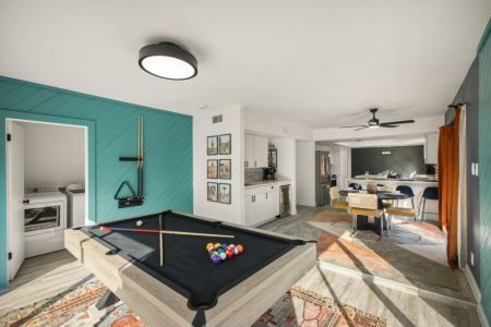 Bring out your competitive side with a game of pool in this vibrant game room.
