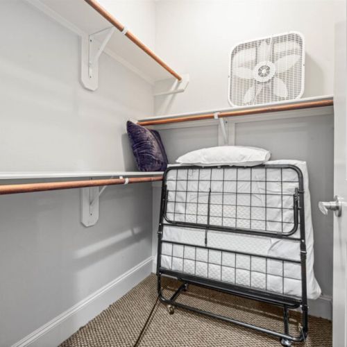 Fully equipped 1st walk-in primary closet with 1 adittional foldable bed.