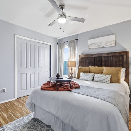 4th bedroom with king size bed and a wooden bench for your comfort.