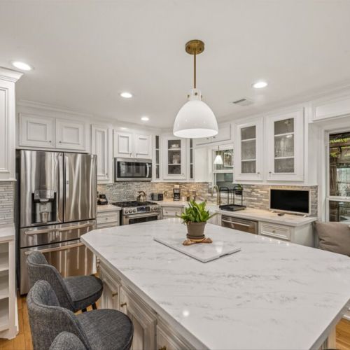 Stainless steel appliances. Fridge dispenses water and ice.