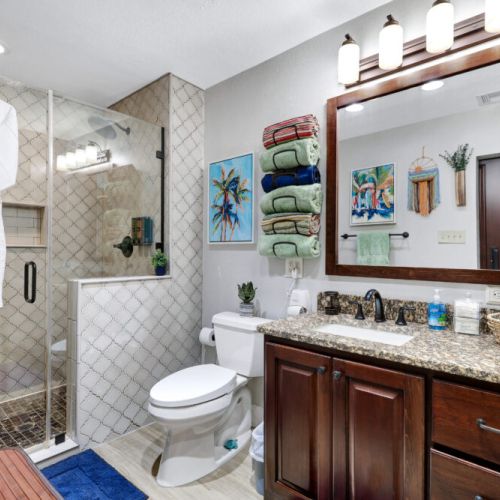 Primary bathroom is fully stocked with all you need. Makeup pads and q-tips included. White robes and towels included.