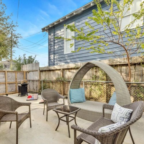 Private patio with a charming patio seating. We also include a gas grill and a cornhole set!