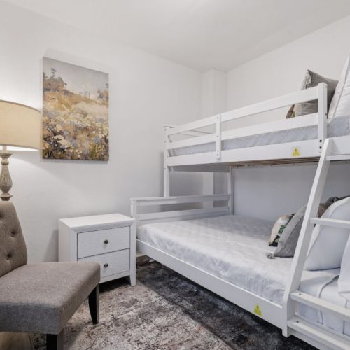 7th bedroom with 1 full size bed and 1 twin size bed (bunk bed).