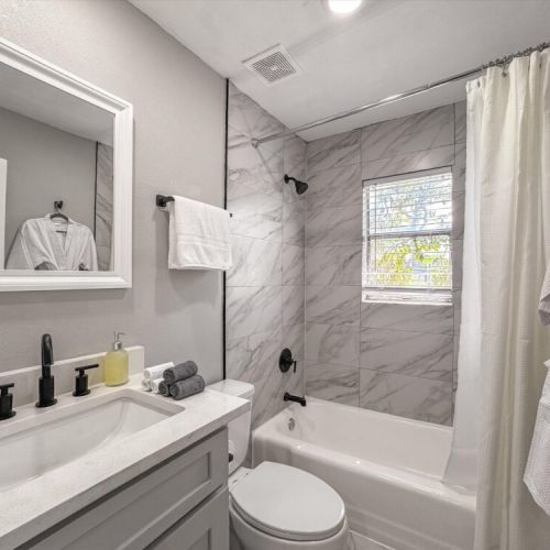Bathroom is fully stocked with all you need. Makeup pads, q-tips, and white robes included.