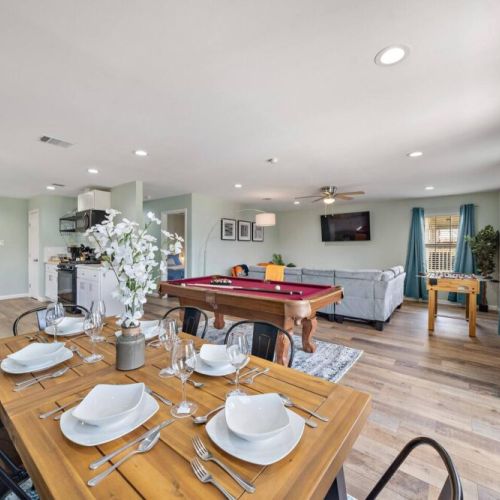 Spacious dining table that sits 6 with full tableware and silverware included.